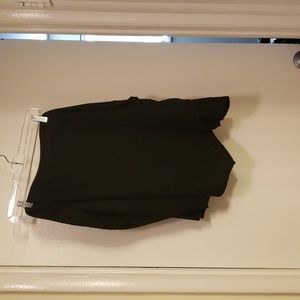 Black skirt. Roughed on left side with asymmetric hem